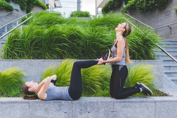 Two Young Sportive Women Stretching — Stock Photo, Image