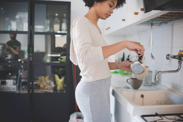 Young Multiethnic Woman Home Preparing Coffee Using Moka Stock Photo