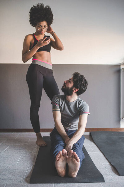 Multiethnic Couple Home Practicing Sport Doing Fitness Yoga Online Class Royalty Free Stock Images