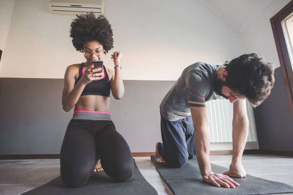 Multiethnic Couple Home Practicing Sport Doing Fitness Yoga Online Class Stock Image