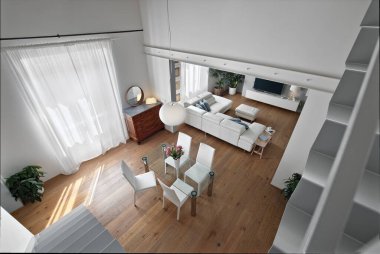 Ön plandaki modern oturma odasının üst manzarası cam masa ve sandalyeli yemek odası arka planda deri bir kanepe ile sohbet alanını görebilirsiniz.