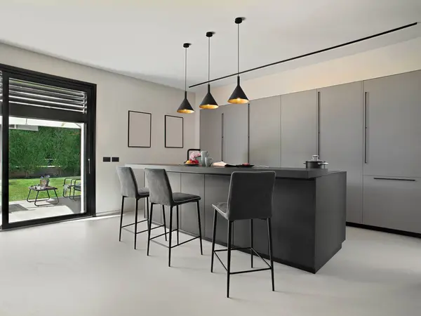 View Modern Kitchen Central Island Featuring Snack Area Stools Illuminated Stock Photo