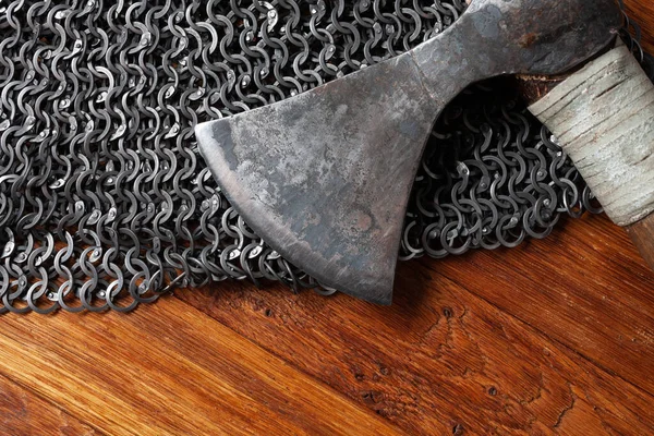 battle axe on chain mail armor background