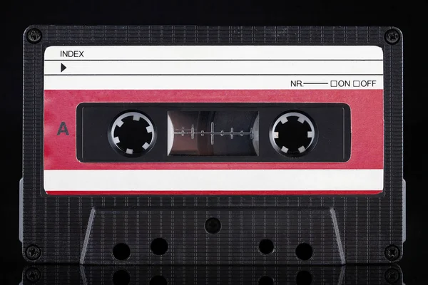 Red Labeled Retro Vintage Compact Cassette Side Black Background — 图库照片