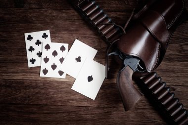 Old west poker - Dead man's hand. Two-pair poker hand consisting of the black aces and black eights, held by Old West gunfighter Wild Bill Hickok when he was murdered while playing a game. clipart