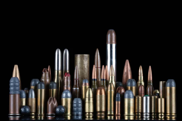 stock image Ammuninition isolated on black background with reflexion. Different cartridges for rifle, pistols and revolvers on a black background.