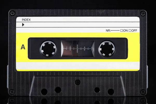Yellow Labeled Retro Vintage Compact Cassette Side Black Background — 图库照片