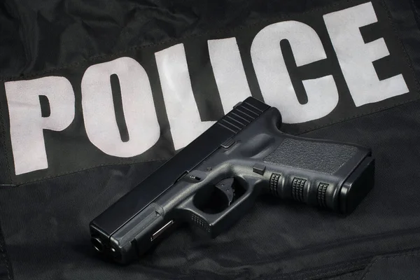 Policie Ruční Zbraň Černém Uniformě Pozadí — Stock fotografie