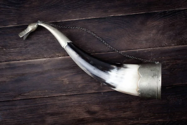 stock image traditional horn for liquor on wooden background