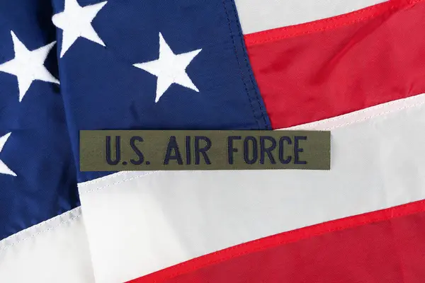 stock image US AIR FORCE branch tape on USA national flag background