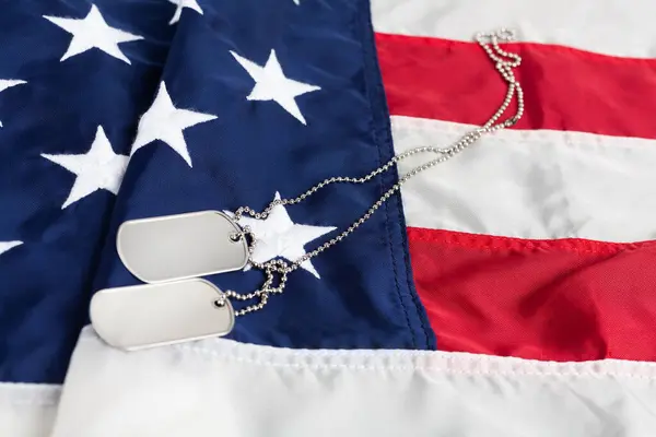 US army dog tags on USA national flag background