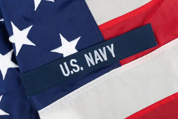 stock image U.S. Navy Branch Tape on national USA flag background