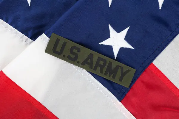 stock image US ARMY Branch Tape on national USA flag background