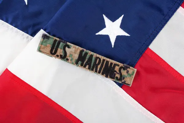 stock image U.S. MARINES Branch Tape on national USA flag background