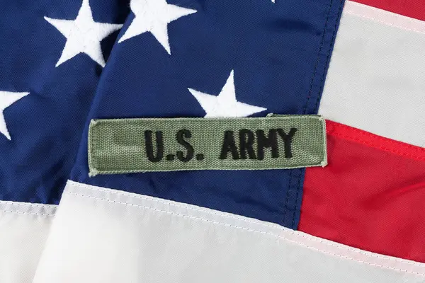 stock image US ARMY Branch Tape on national USA flag background