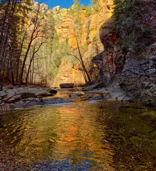 A section of the West Fork Creek north of Sedona AZ reflecting the golden light of the late day sun.