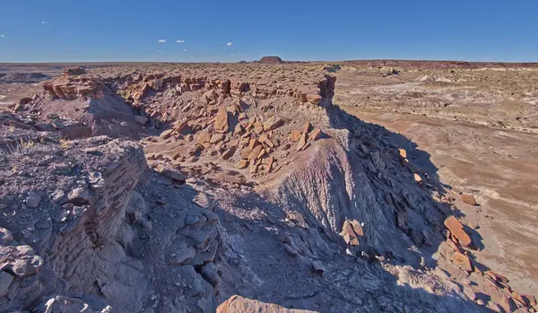 The crumbling cliffs of a mesa near Hamilili Point on the south end of Petrified Forest National Park Arizona.