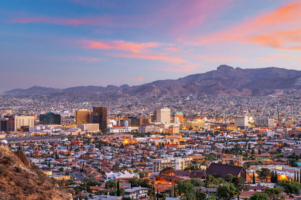 El Paso, Texas, USA  downtown city skyline at dusk with Juarez, Mexico in the distance.