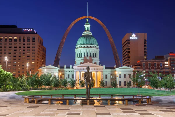 ST. LOUIS, MISSOURI, USA - August 23, 2018: View from Kiener Plaza Park with the The Olympic Runner Statue, Old Courthouse, and Gateway Arch at twilight.