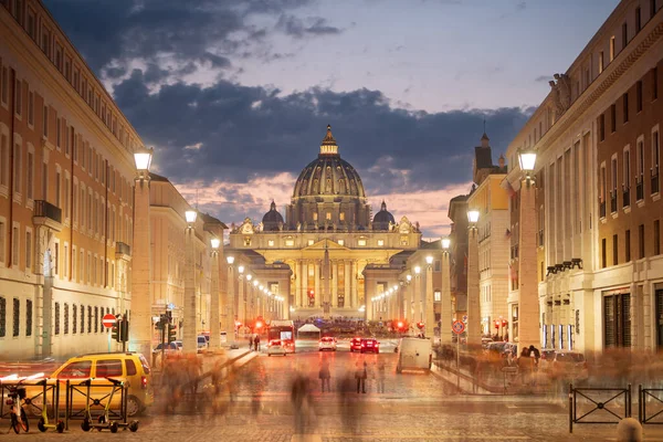 Vatican City with St. Peter\'s Basilica at twilight. (Text on Basilica translates to: \