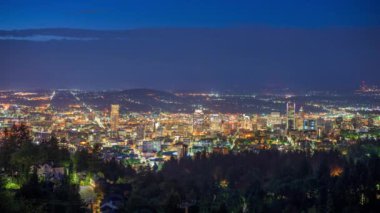 Portland, Oregon downtown city skyline at dawn with Mt. Hood.