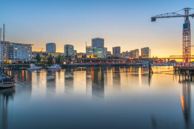 Tacoma, Washington, USA downtown skyline at dusk on Commencement Bay. clipart