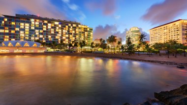 San Juan, Puerto Rico resort skyline on Condado Beach at twilight. clipart