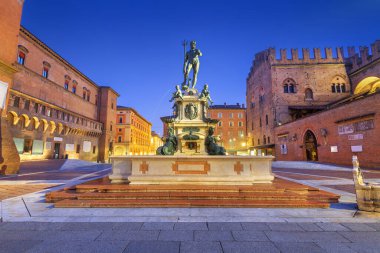 Bologna, Italy with the Fountain of Neptune at twilight. clipart