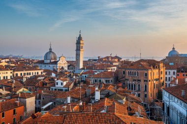 Venice; Italy rooftop skyline towards San Giorgio dei Greci and its leaning bell tower.