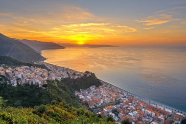 Bagnara Calabra, Italy cityscape overlooking the Tyrrhenian Sea at sunset. clipart