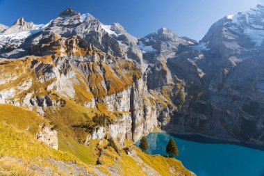 Oeschinen Lake near Kandersteg, Switzerland during autumn season. clipart