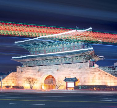 Seoul, South Korea cityscape and traffic Dongdaemun Gate at night. clipart