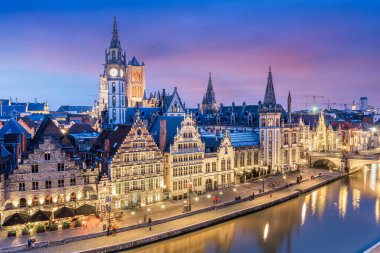 Ghent, Belgium old town cityscape overlooking the Graslei area at dusk. clipart