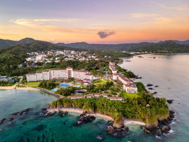 Resorts along the coast of the main island of Okinawa, Japan. clipart