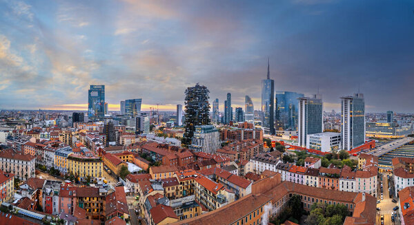 Milan, Italy financial district cityscape at dawn.