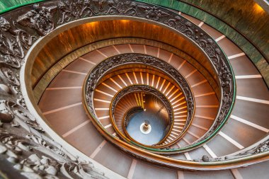 VATICAN - DECEMBER 9, 2021:  Bramante Staircase in the Vatican Museum. clipart