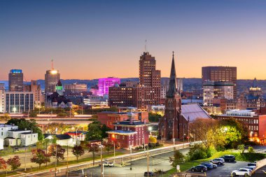 Syracuse, New York, USA town skyline at dusk. clipart