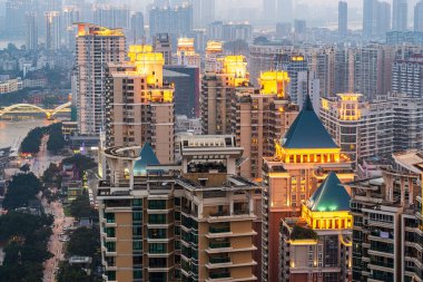 Fuzhou, Fujian, China apartment block skyline at dusk. clipart