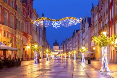 Golden gate of Long market decorated with Christmas illuminations at night, Gdansk, Poland. clipart