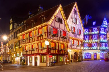 Traditional half-timbered houses in old town of Colmar at Christmas time, Alsace, France clipart