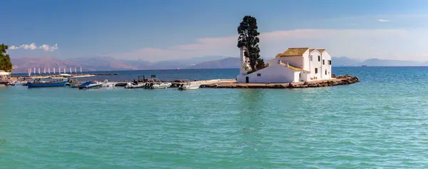 stock image Vlacherna Monastery in Corfu, Greece, with Ionian Sea and distant mountains in background