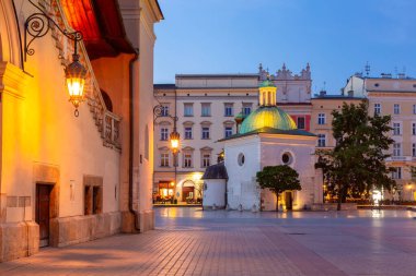 Morning view of St Adalberts Church on Main Market Square in Krakow, Poland, illuminated by soft light clipart