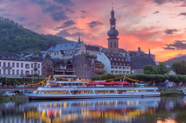 Sunset view over Cochem with St. Martins Church and traditional buildings along the Moselle River, Germany clipart