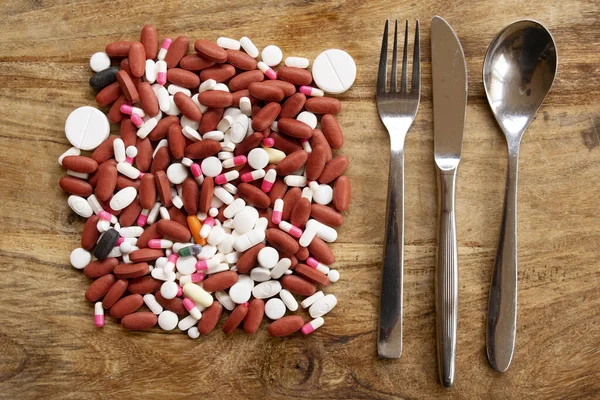 Voedsel Gezondheidsconcept Met Een Verzameling Pillen Bestek — Stockfoto