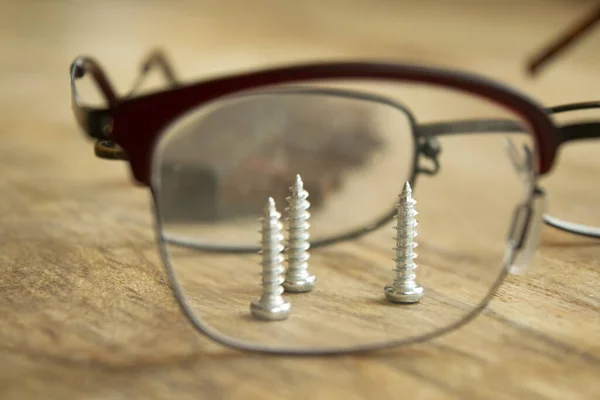 Three Screws Seen Eyeglass Lens — Stock Photo, Image