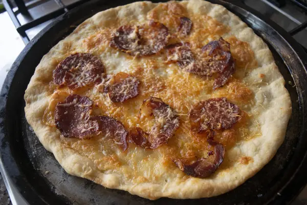 stock image pizza alla diavola with mozzarella and hot salami