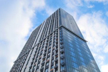 Bottom view of modern skyscrapers i against sky. 