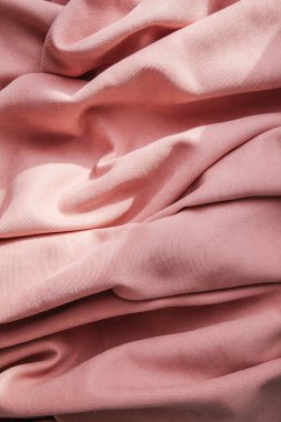Folds of pink fabric, abstract background