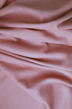 Folds of pink fabric, abstract background