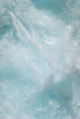 Pamuk helva, yumuşak mavi arka plan